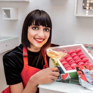 Rosie Ginlay holding a tray of macarons